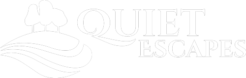 Quiet Escapes Logo, reverse in white